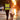 Person in reflective vest walking dog at sunset using a hands-free dog leash for visibility and safety on wet roads.